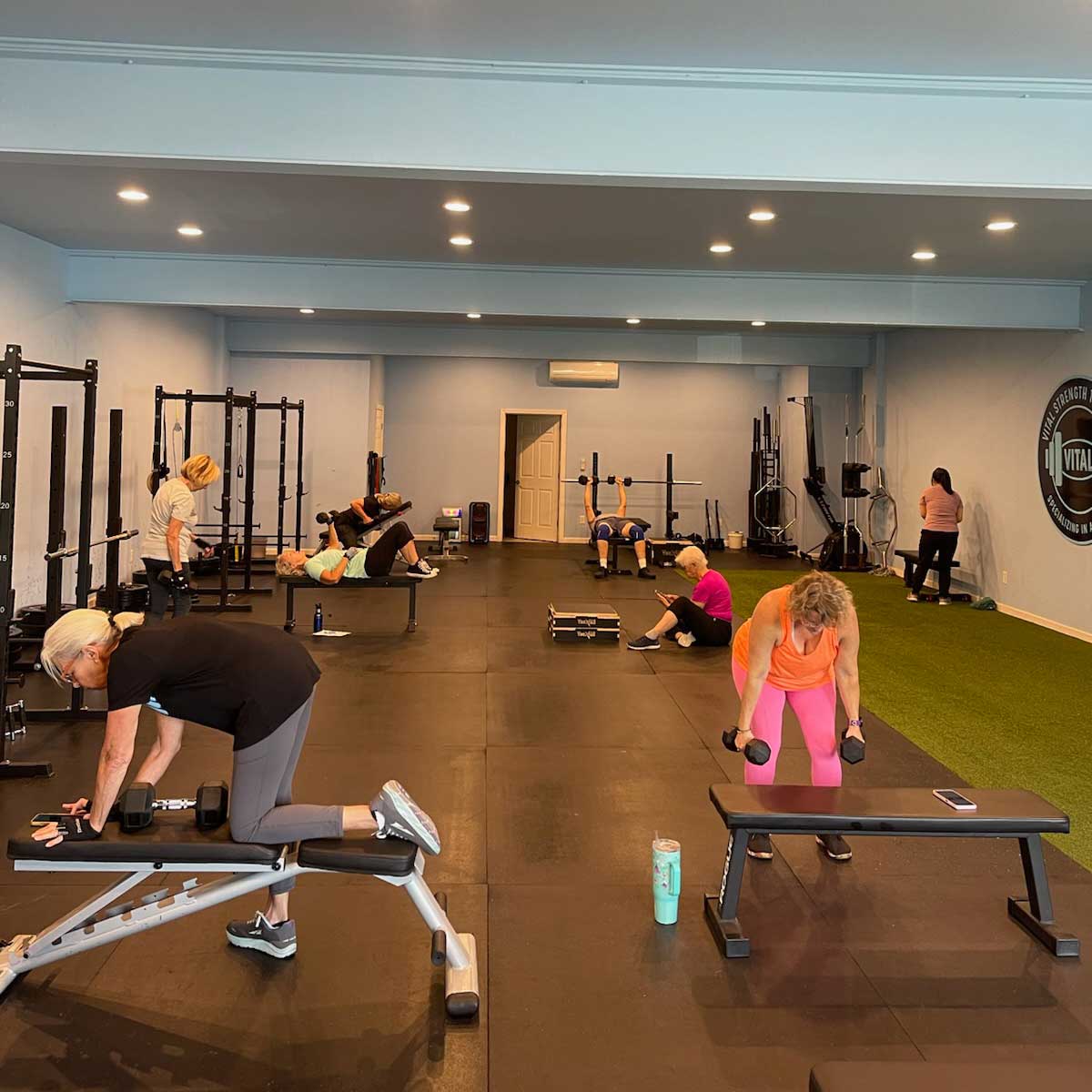 The Thrive Group Strength Training gym, bustling with members working out