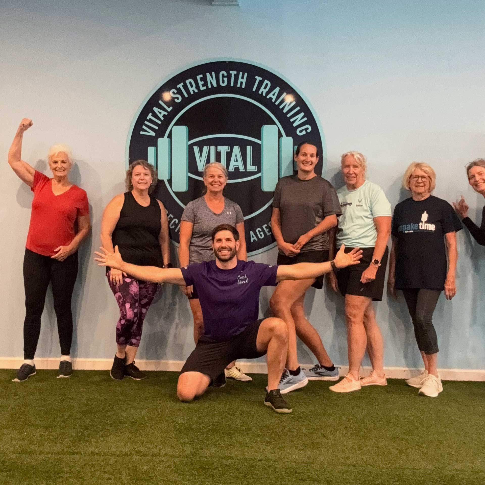 Vital Strength Training class at Thrive Strength & Wellness posing with their personal trainer